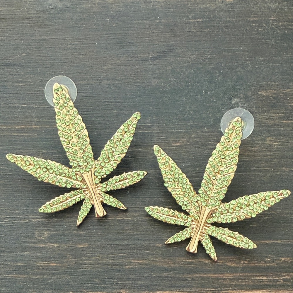 Meghan Fabulous Cannabis Pot Leaf Earrings Gold with Green Crystals